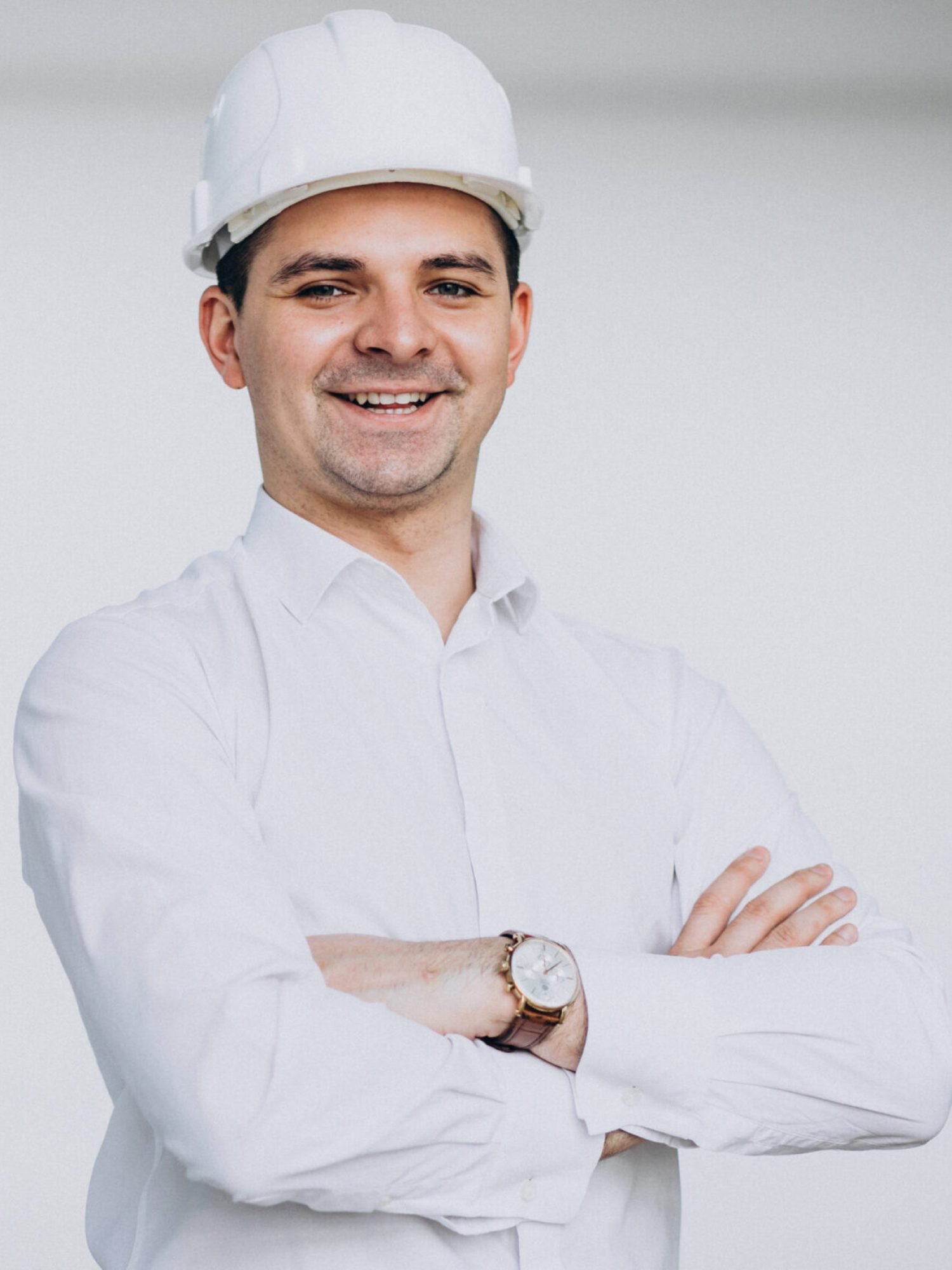Handsome business man engineer in hard hat in a building